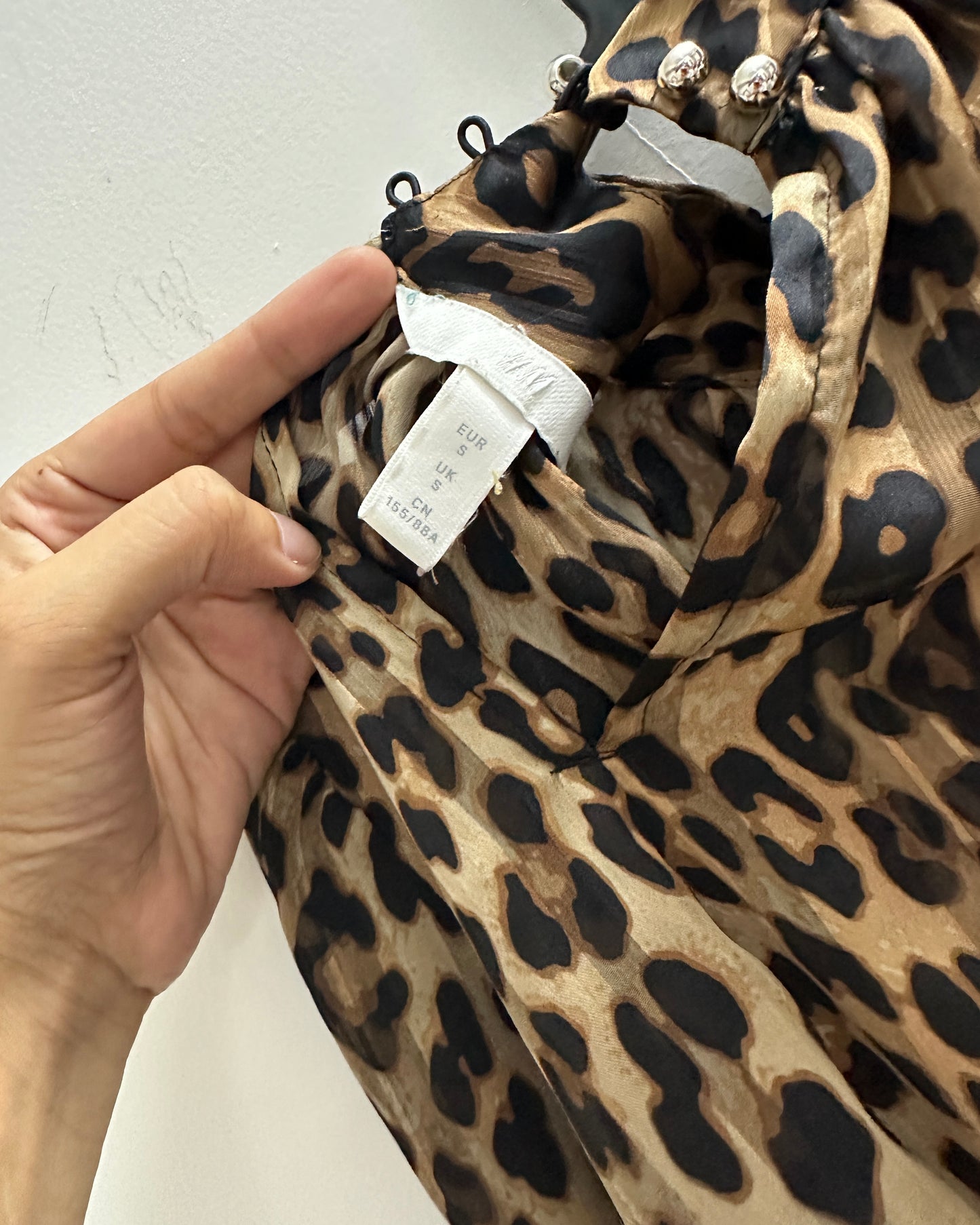 Animal print blouse with gold buttons