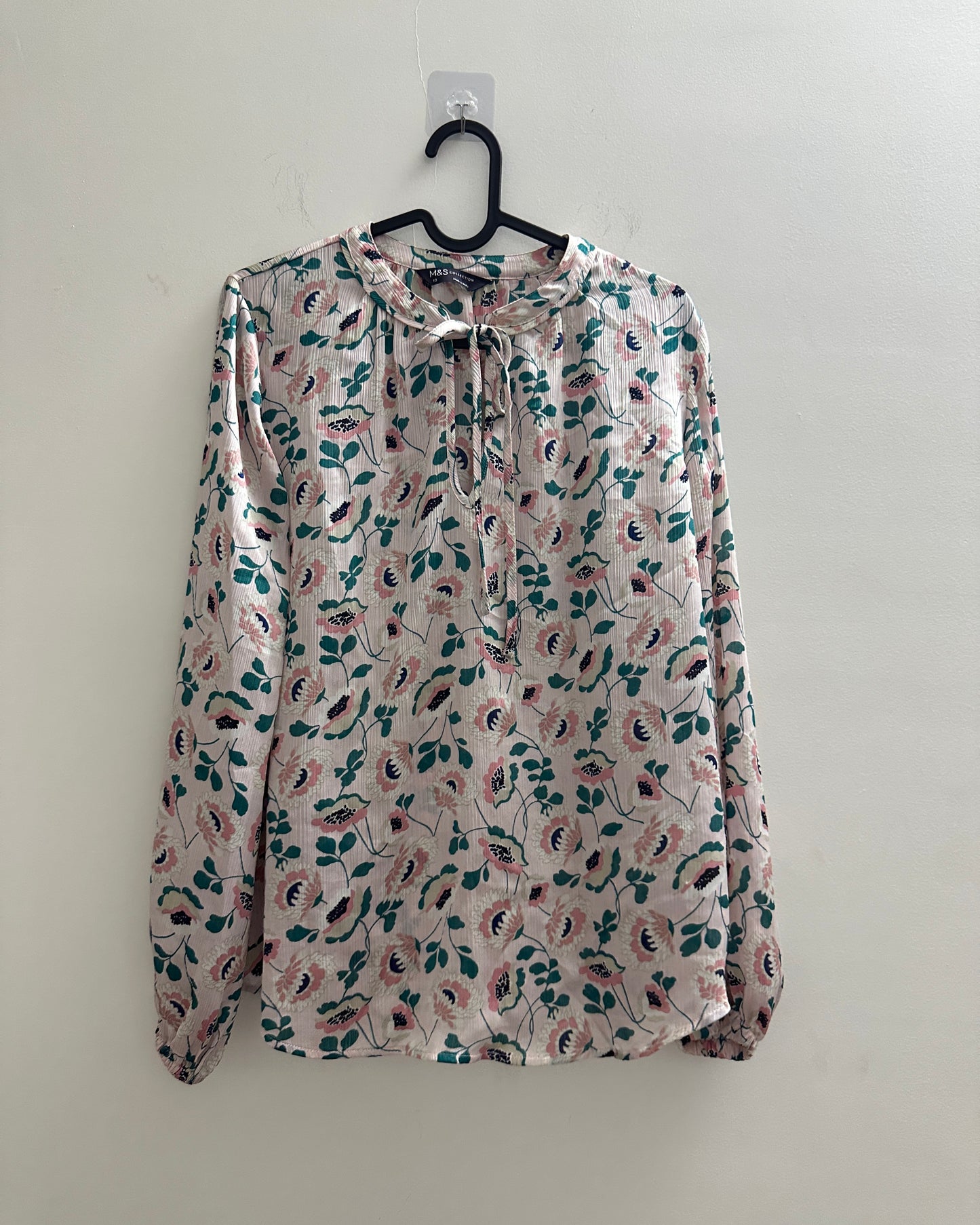 Pastel pink blouse top with floral print