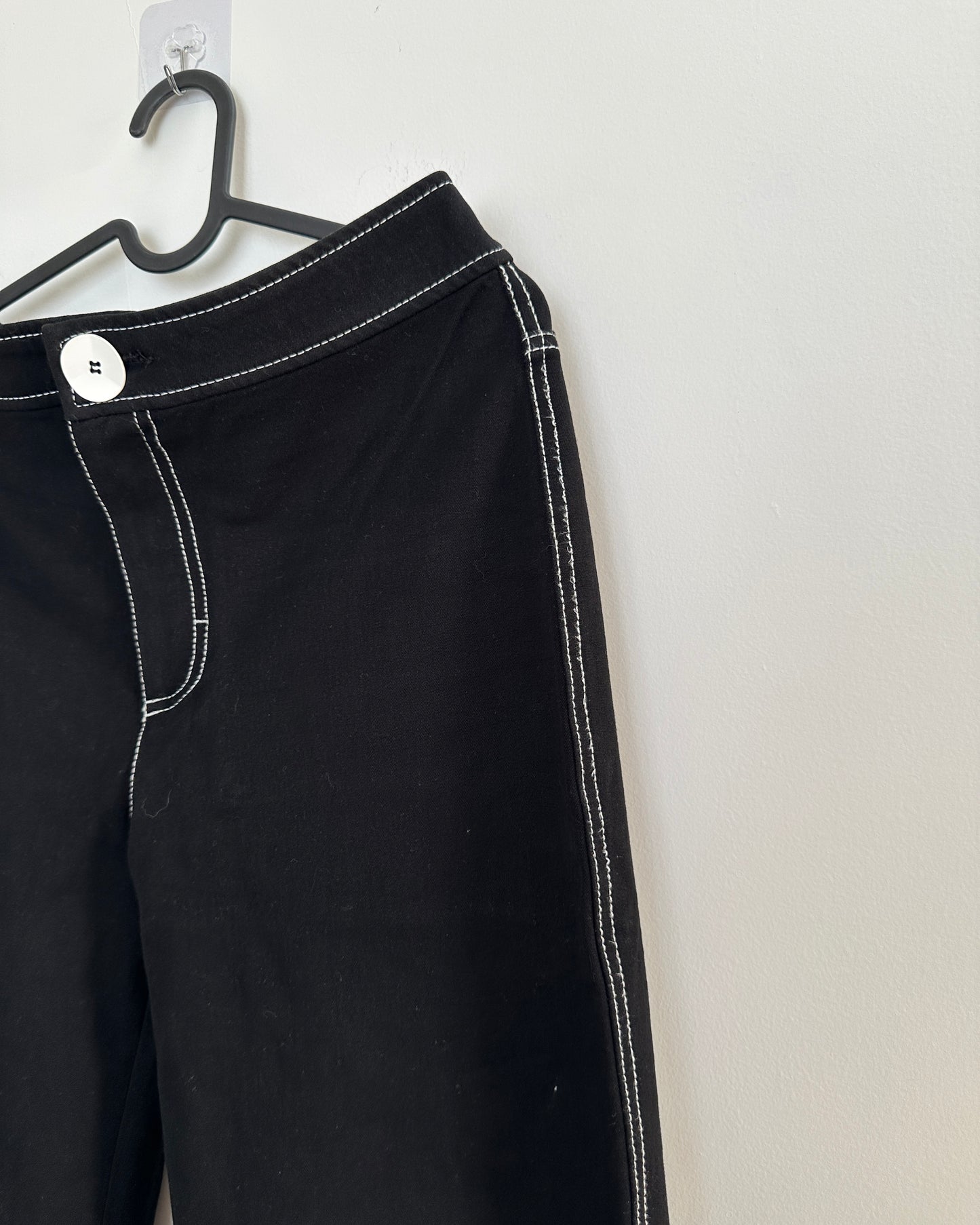 Black stretchable trousers with contrast white stitch