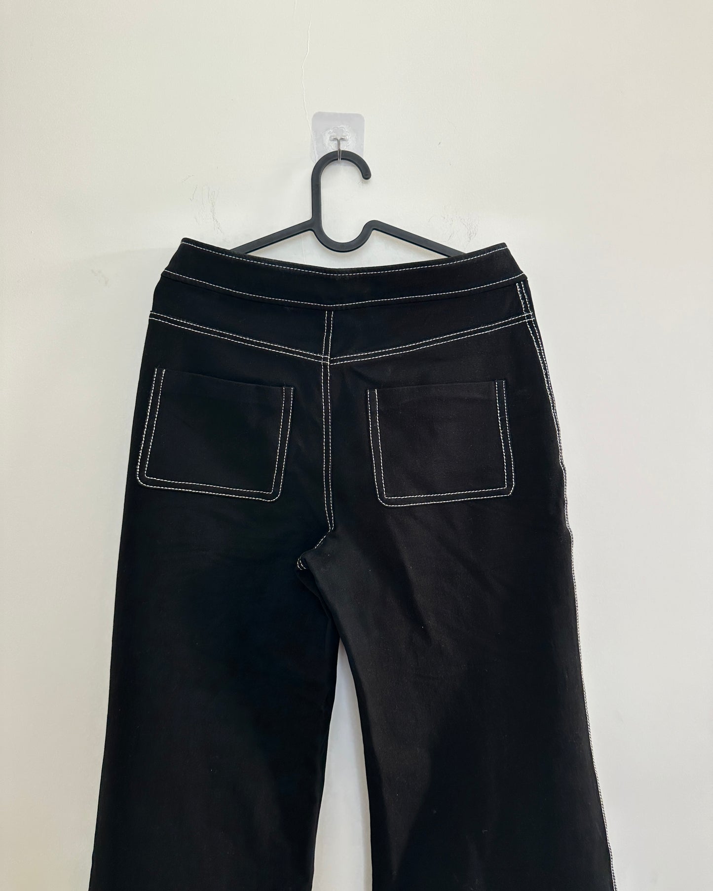 Black stretchable trousers with contrast white stitch