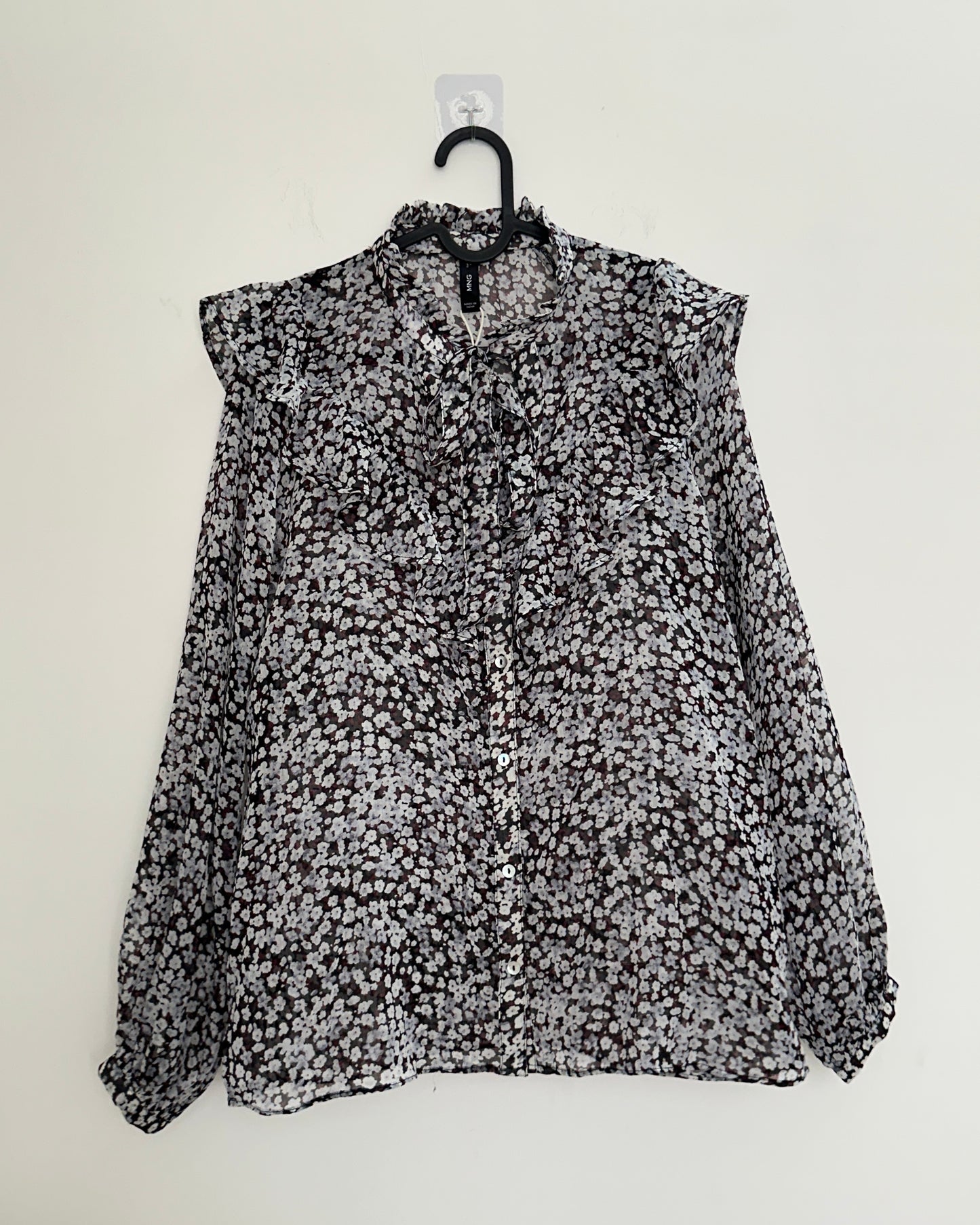 Black floral blouse with ruffles