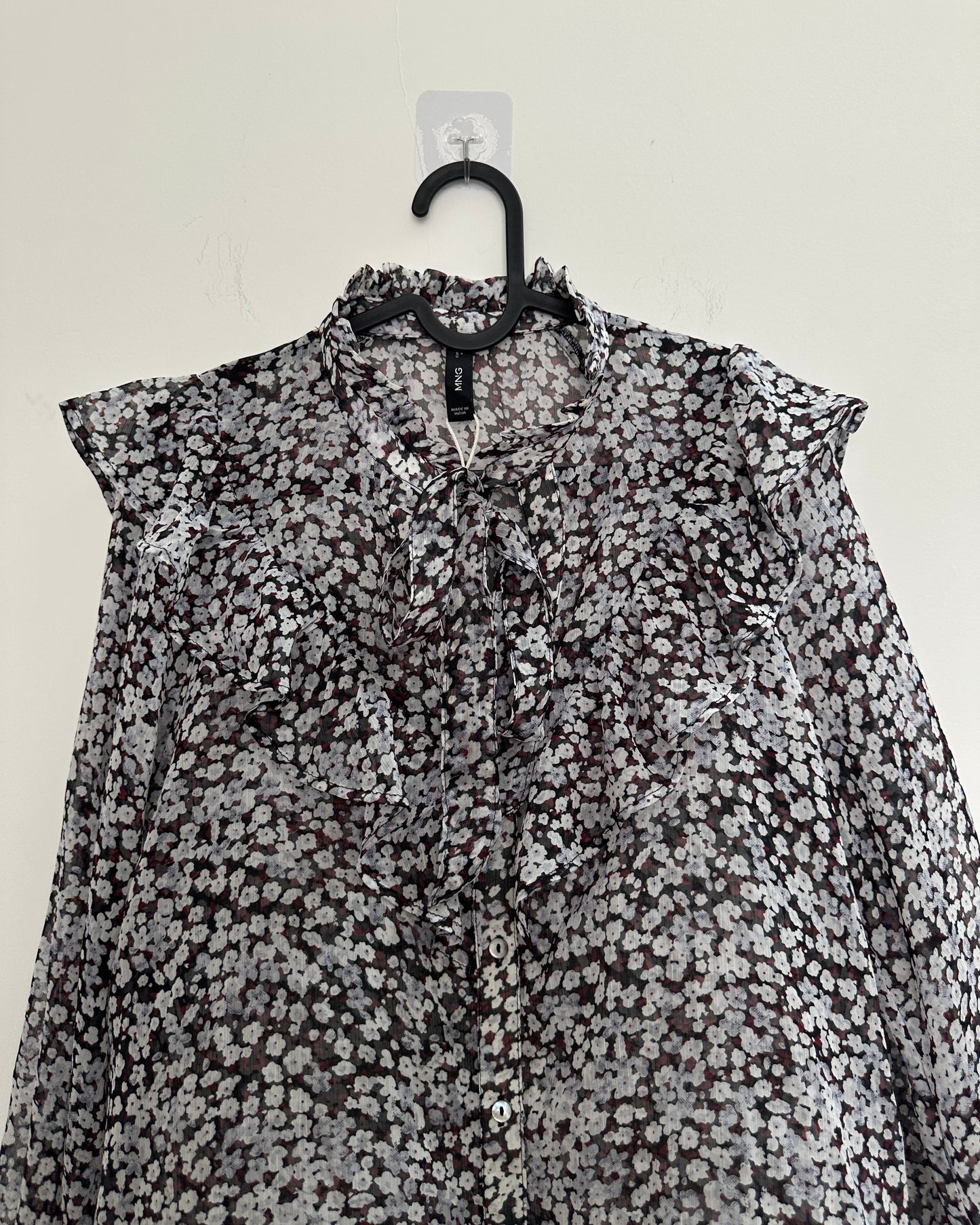 Black floral blouse with ruffles