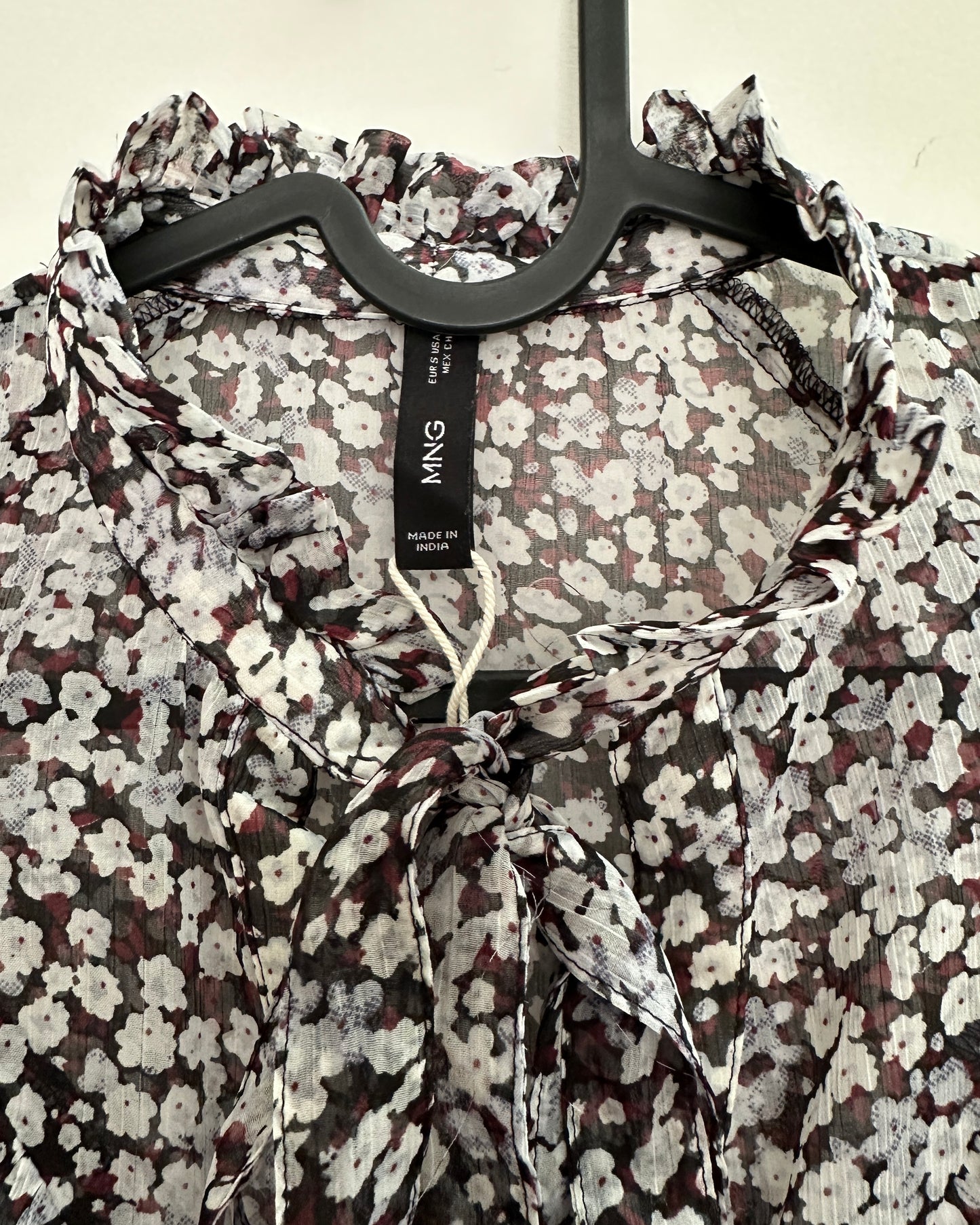 Black floral blouse with ruffles