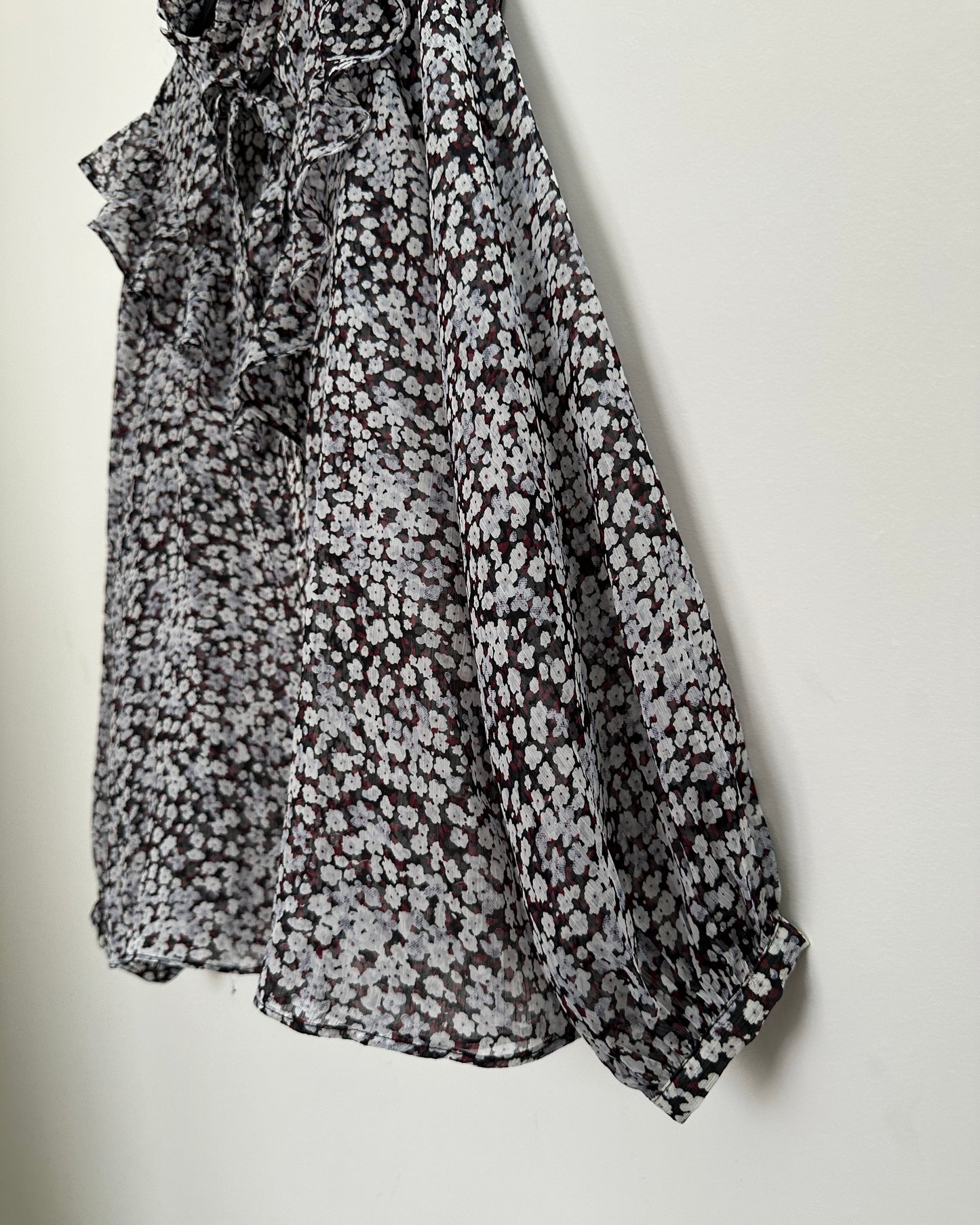 Black floral blouse with ruffles
