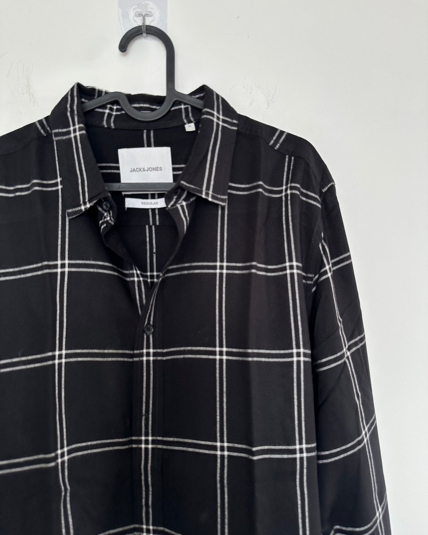 Black shirt with white checks