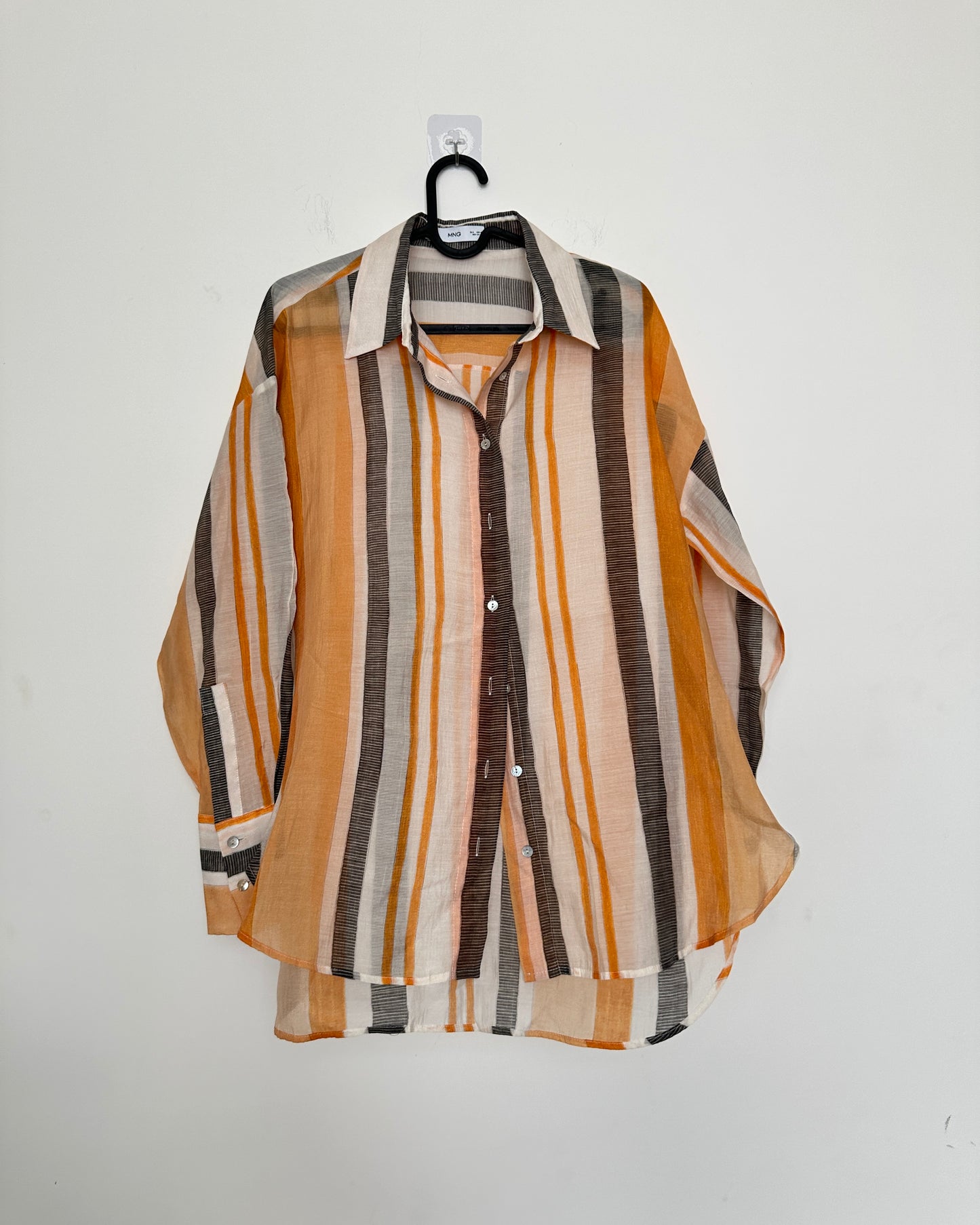 White shirt with black and orange stripes