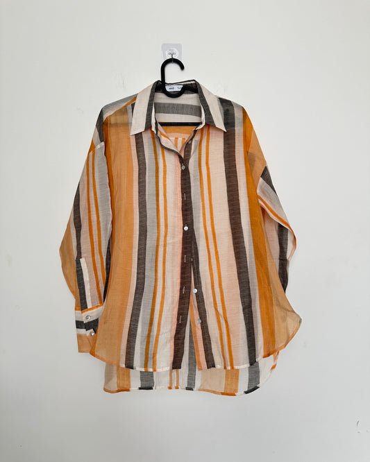 White shirt with black and orange stripes