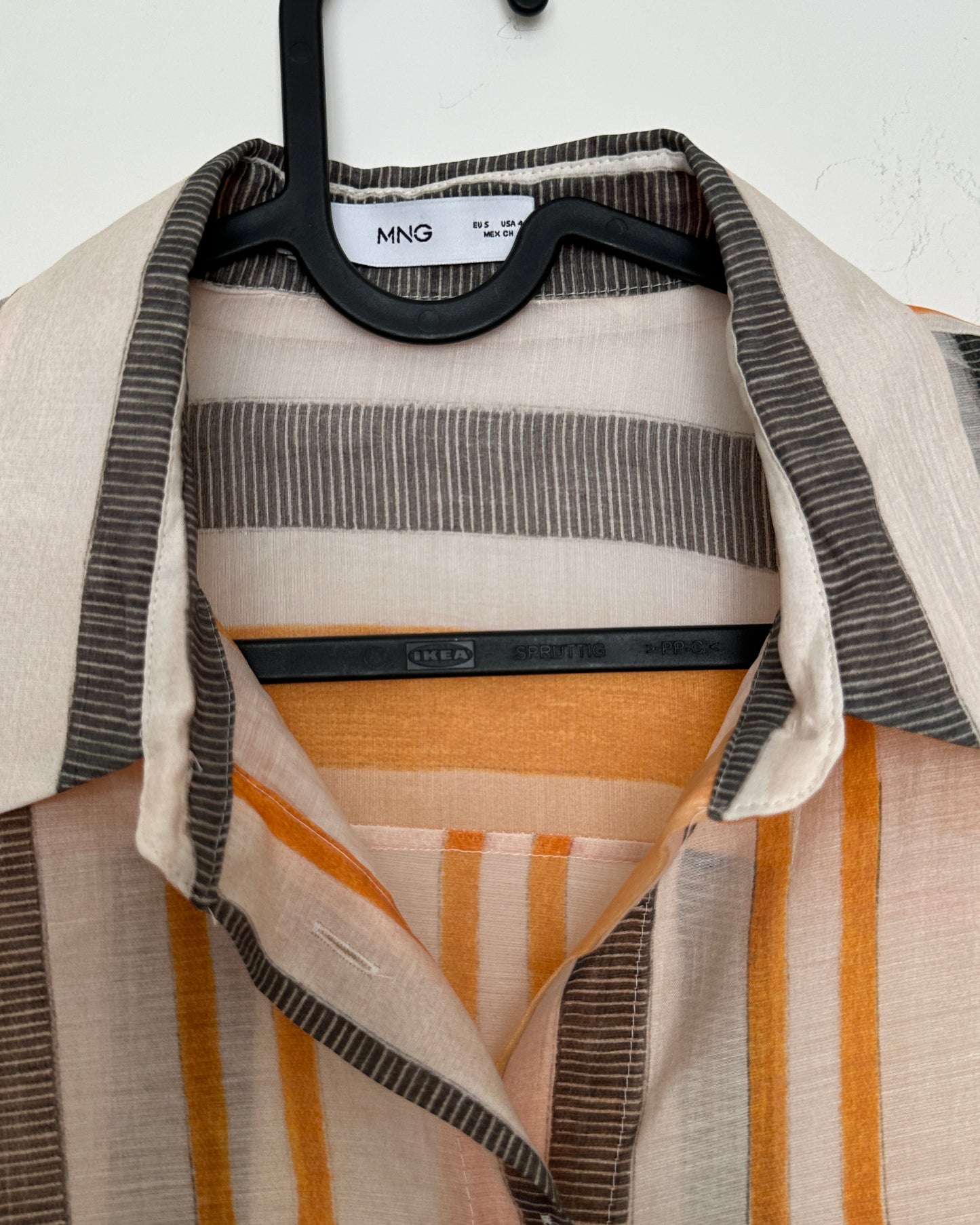 White shirt with black and orange stripes