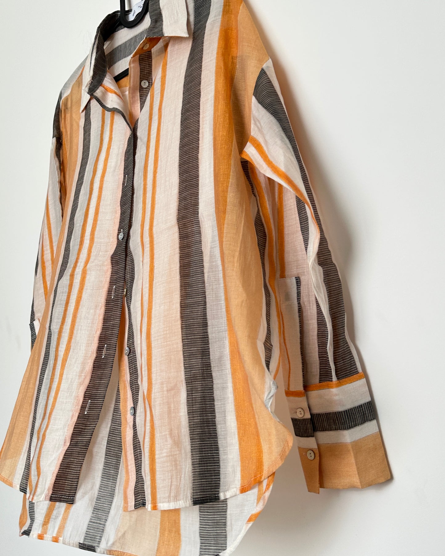 White shirt with black and orange stripes