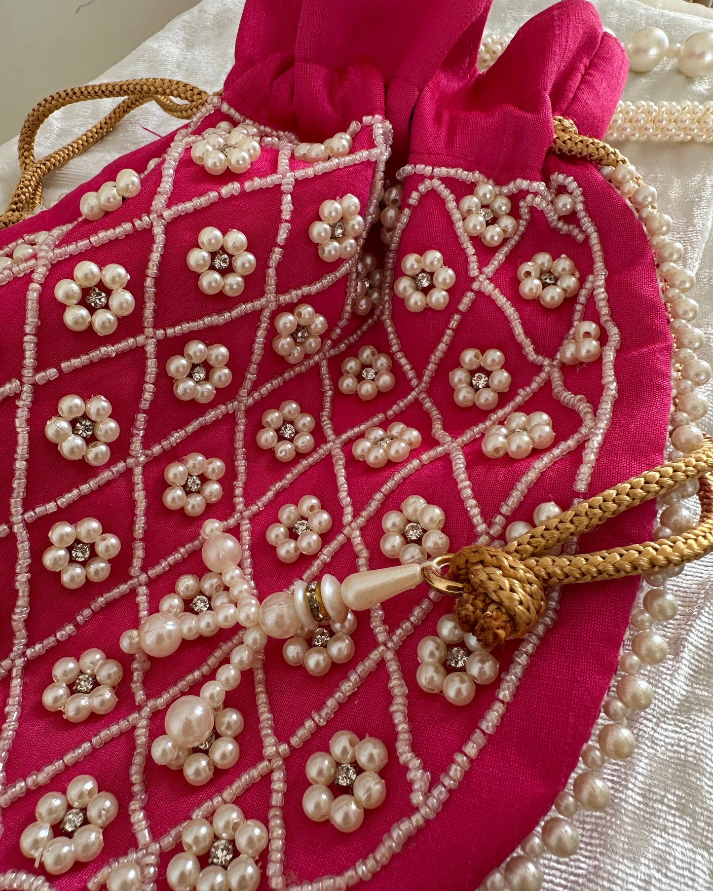 Pink embroidered potli bag