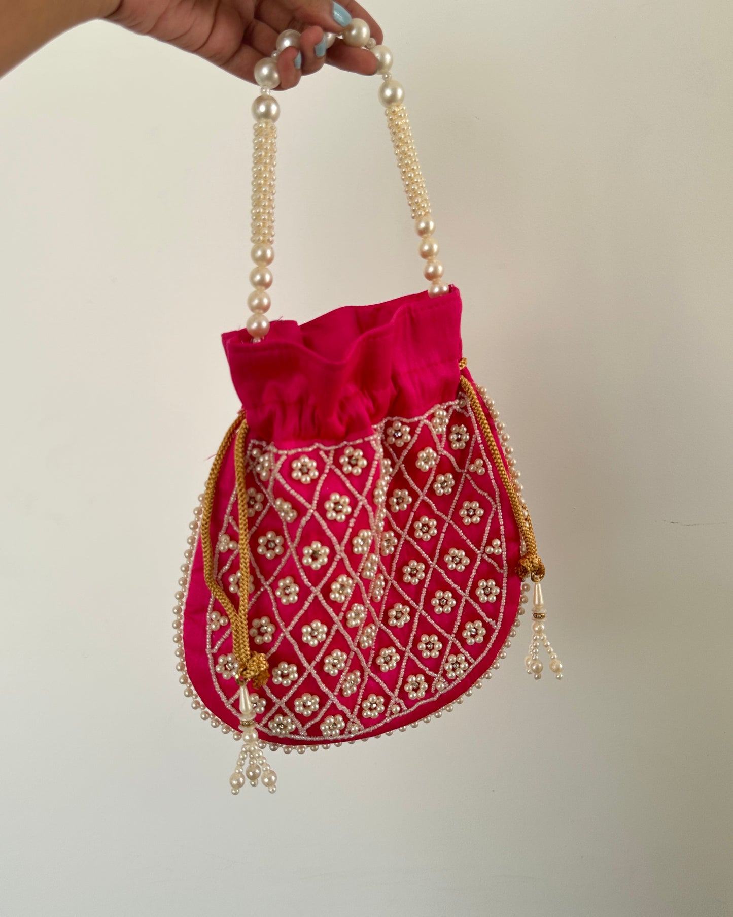 Pink embroidered potli bag