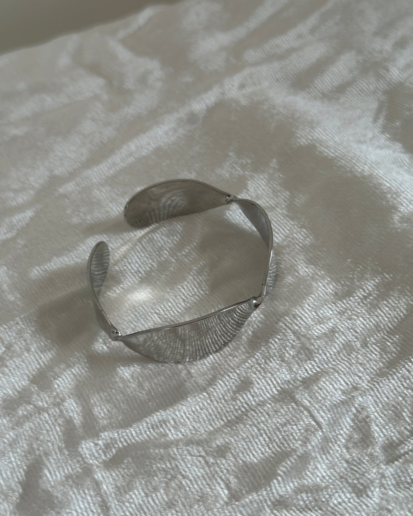 Silver adjustable twisted design cuff