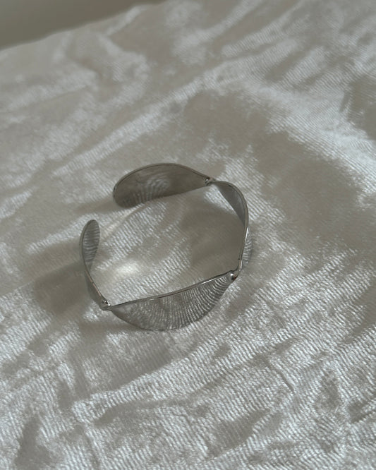 Silver adjustable twisted design cuff