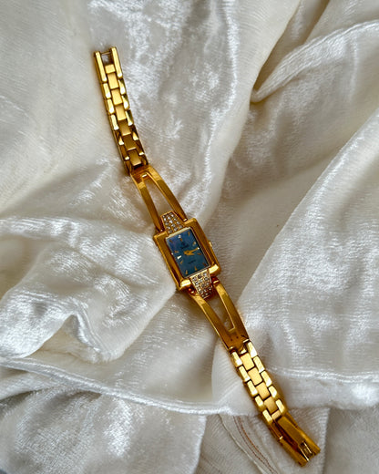 Gold studded watch with blue dial