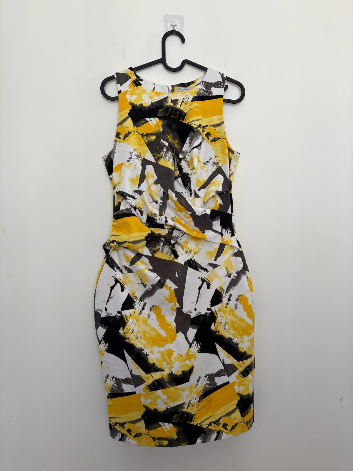 The Circle sleeveless sheath dress featuring a mustard yellow, charcoal grey, and white abstract brushstroke print.
