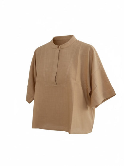 The Circle beige linen-blend boxy top with a mandarin collar and elbow-length sleeves in a minimalist style.