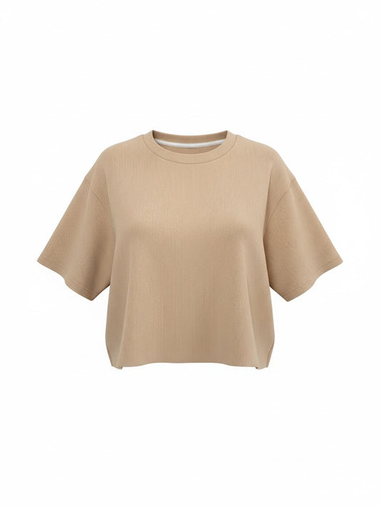 The Circle beige ribbed knit short sleeve boxy crop top with a crew neckline and relaxed fit.