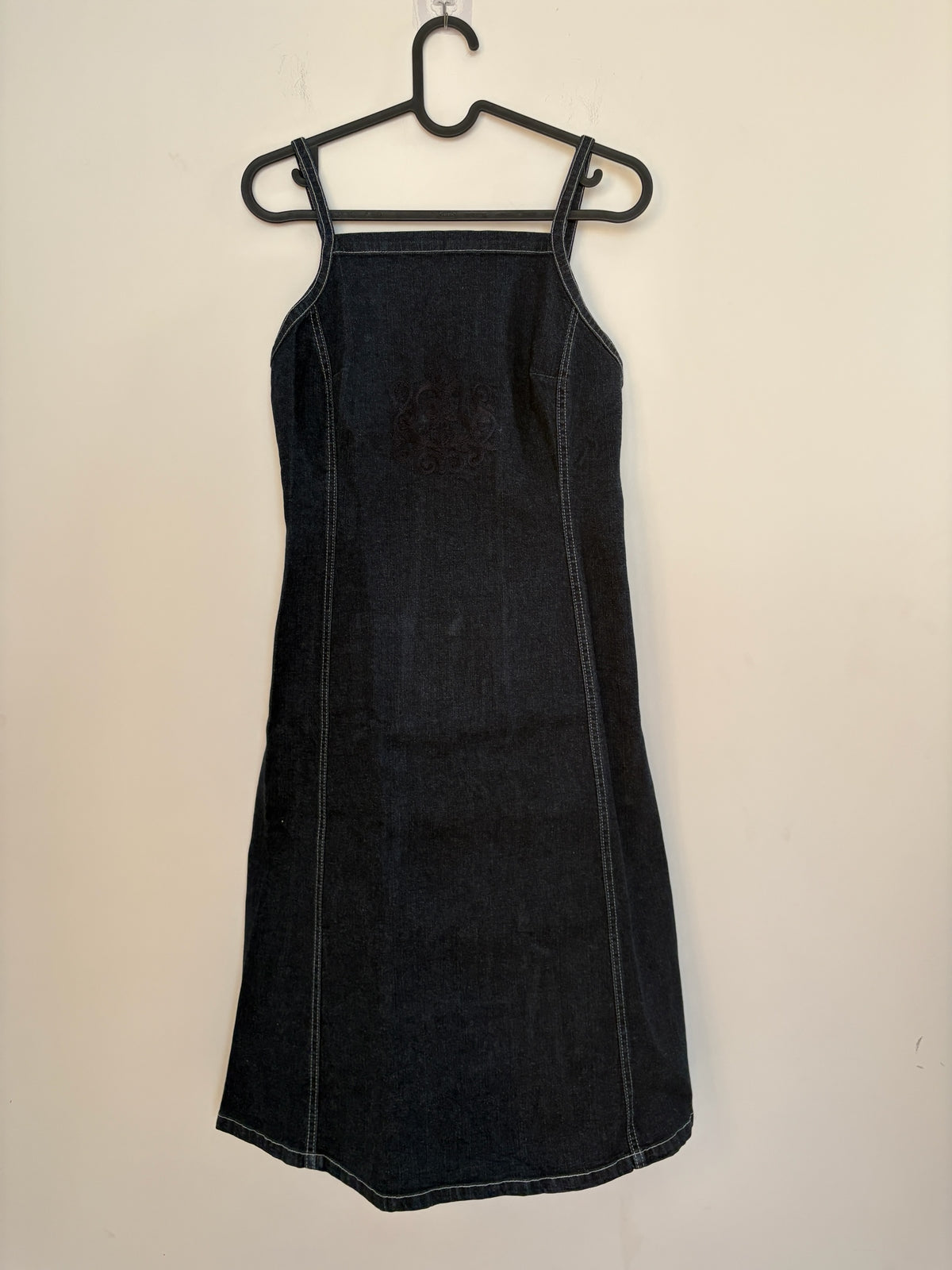 The Circle Betty Jackson Studio dark denim midi dress with square neckline, spaghetti straps, and white topstitching.