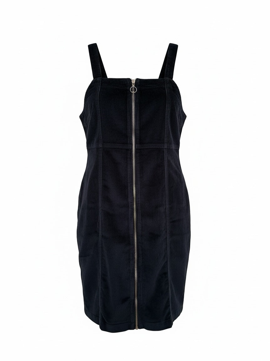 The Circle black corduroy sleeveless pinafore dress with a square neckline and full-length front ring-pull zipper.