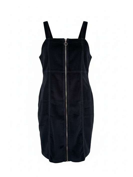 The Circle black corduroy sleeveless pinafore dress with a square neckline and full-length front ring-pull zipper.