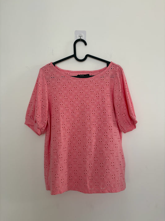 The Circle bossini pink eyelet embroidered casual top with round neckline and short puff sleeves on a hanger