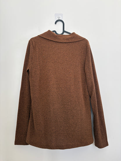 The Circle brown ribbed knit long-sleeve shirt with a polo collar, shown from the back on a hanger.
