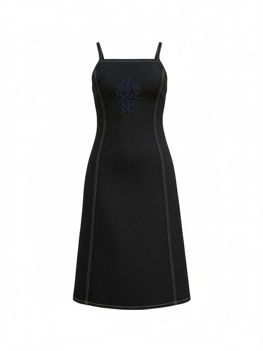 The Circle Betty Jackson Studio dark indigo denim midi dress with square neckline, white topstitching, and embroidery.