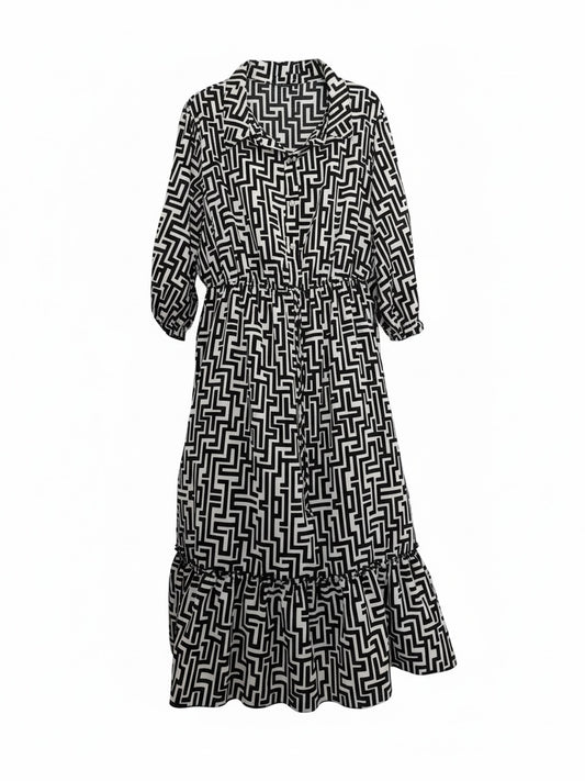 The Circle black and white geometric print midi dress with a button-down front, shirt collar, and tiered ruffle hem.