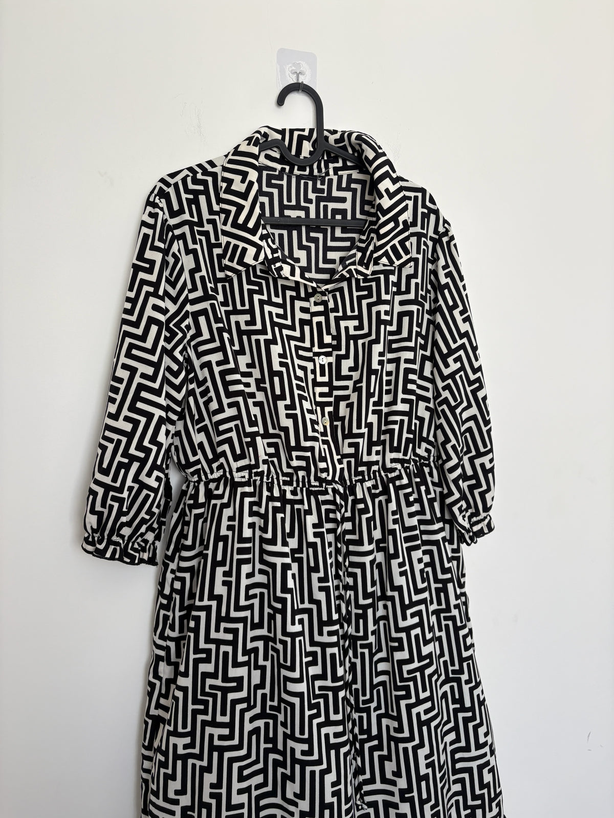 The Circle black and white geometric print midi dress with a button-down front, shirt collar, and three-quarter sleeves