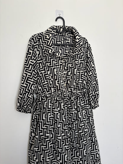 The Circle black and white geometric print midi dress with a button-down front, shirt collar, and three-quarter sleeves