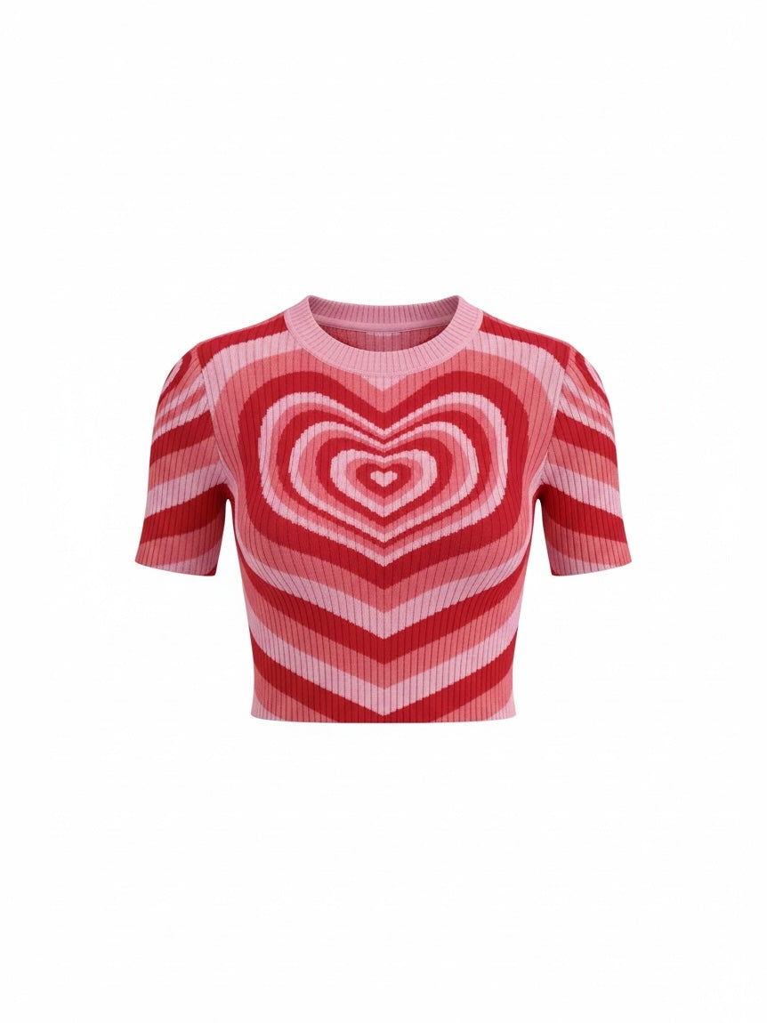 The Circle short sleeve knit crop top featuring a bold pink and red concentric heart pattern and ribbed texture.