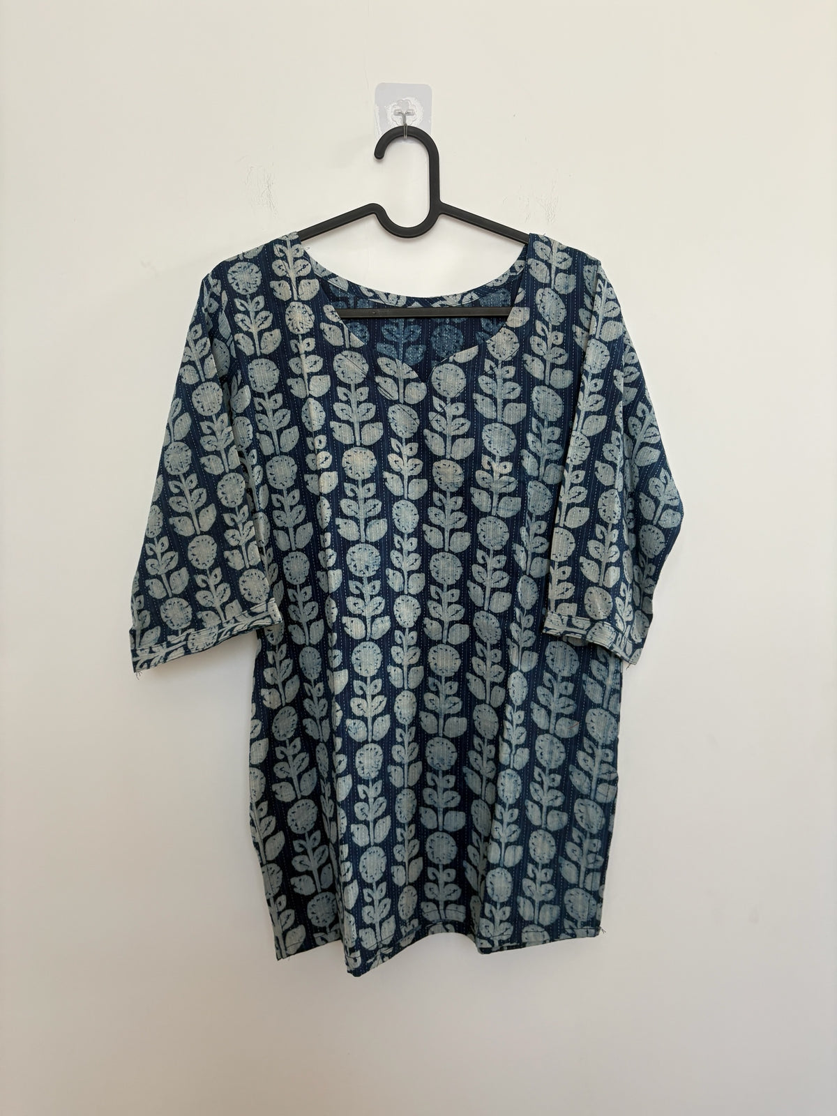 The Circle indigo cotton kurti featuring a hand block printed botanical floral pattern and three-quarter sleeves.