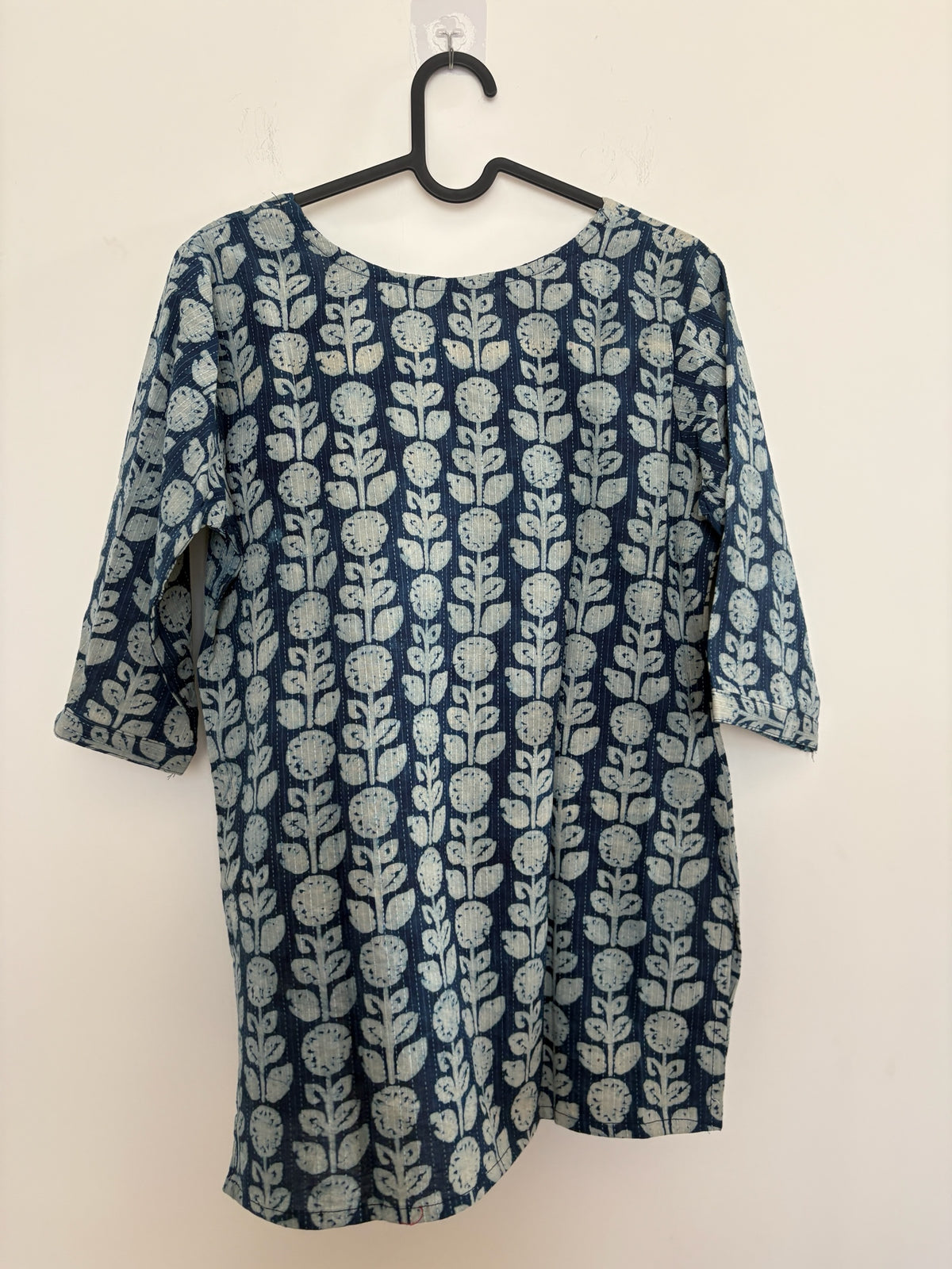 The Circle indigo cotton kurti with off-white botanical block print, round neckline, and three-quarter sleeves.