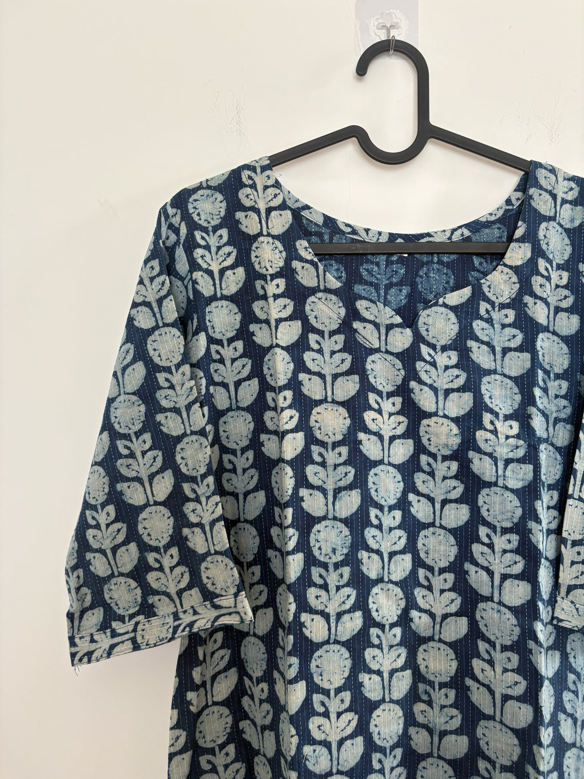 The Circle indigo cotton kurti featuring a white botanical block print with a round neckline and three-quarter sleeves