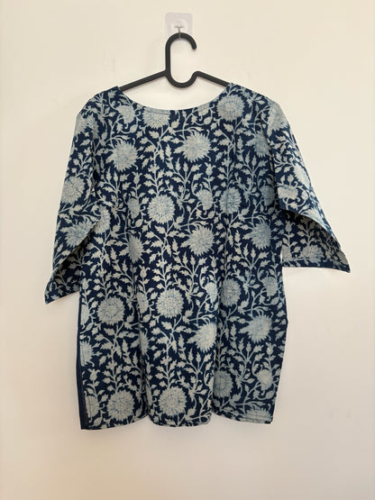 The Circle indigo cotton kurta with white hand-block floral print, featuring a relaxed fit and three-quarter sleeves.