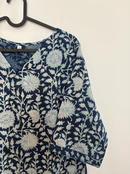 The Circle indigo cotton kurta featuring a white hand-block floral print, V-neckline, and three-quarter sleeves.