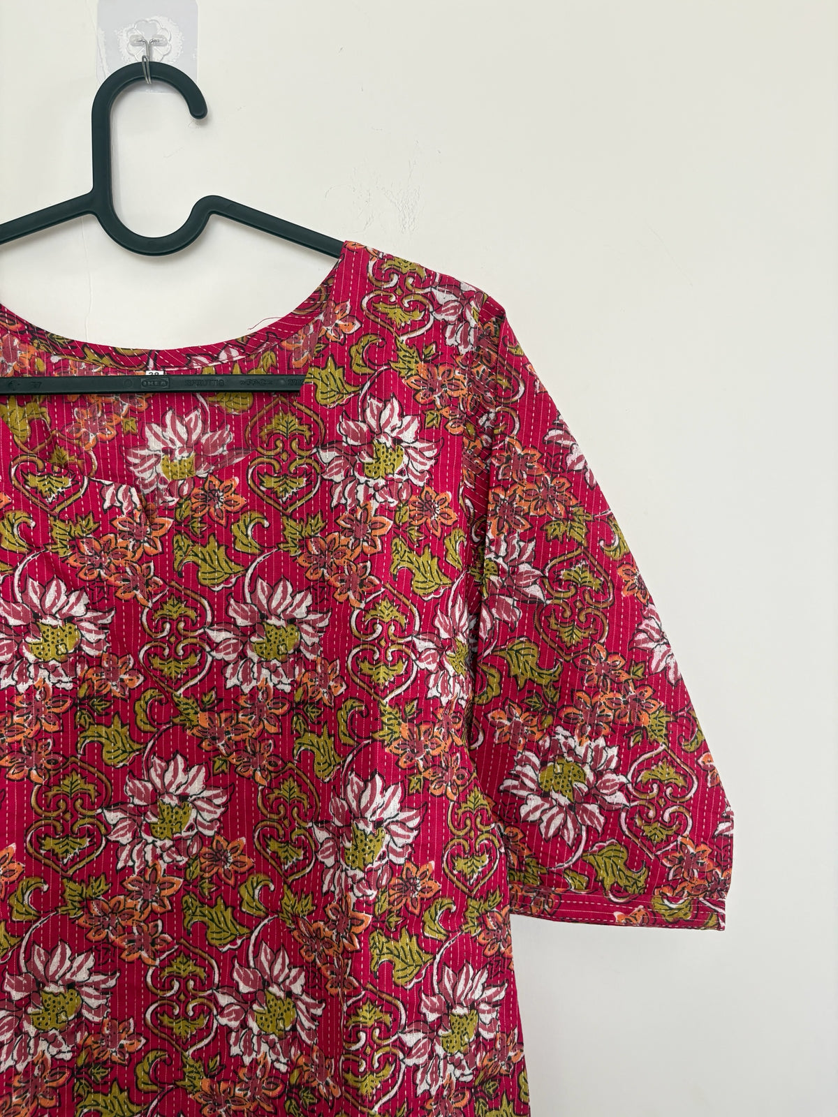 The Circle magenta cotton kurti with floral block print, kantha stitching, round neck, and three-quarter sleeves.