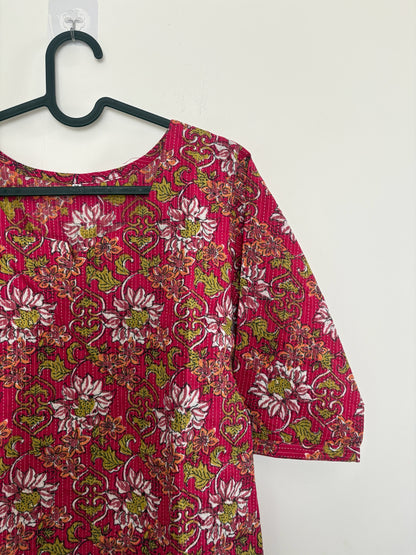 The Circle magenta cotton kurti with floral block print, kantha stitching, round neck, and three-quarter sleeves.