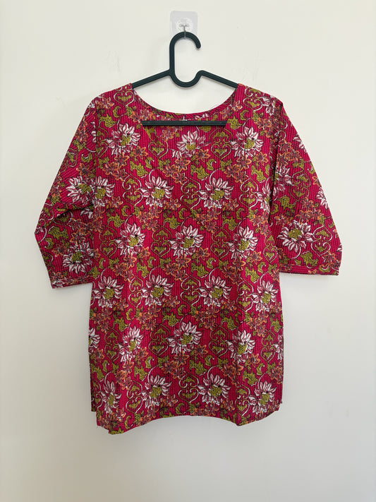 The Circle magenta cotton kurti with floral print, kantha quilting, round neck, and three-quarter sleeves.