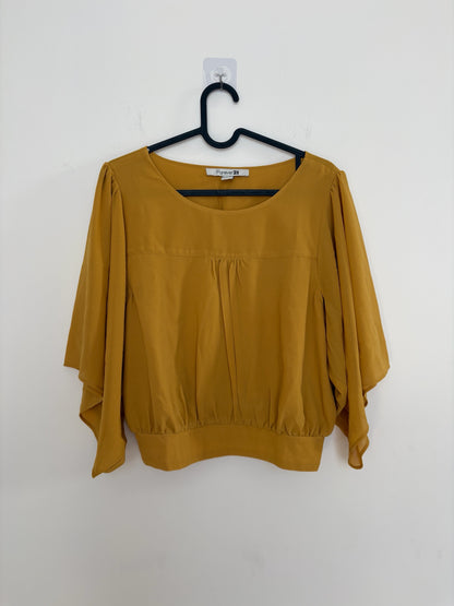 The Circle Forever 21 mustard yellow blouse with flutter sleeves, round neckline, and gathered front detail.