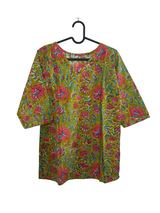 The Circle olive green cotton kurti with pink and teal floral block print, V-neckline, and half sleeves on a hanger.