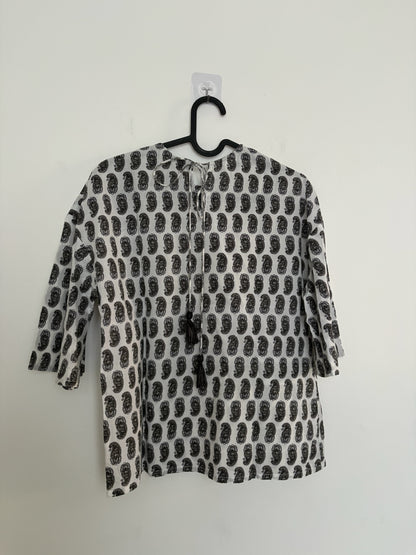 The Circle monochrome paisley print top with three-quarter sleeves and back tie-up detail with tassels