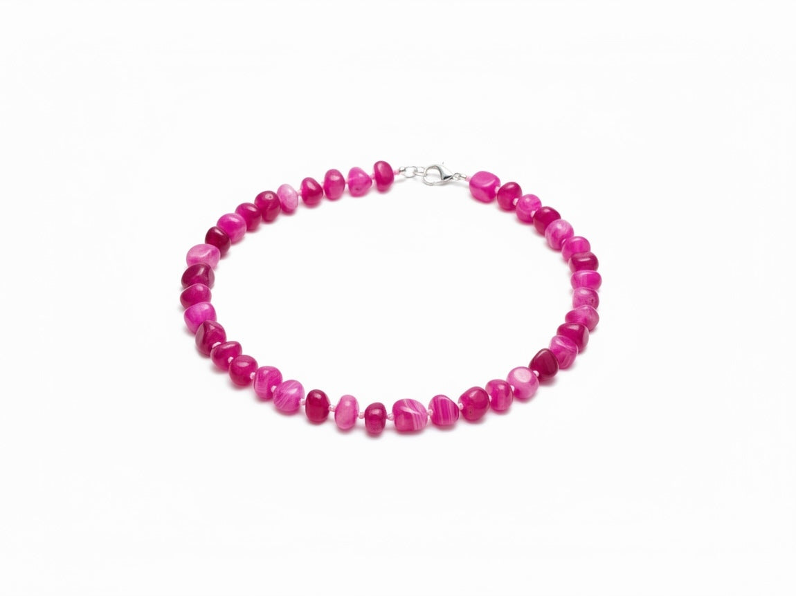 The Circle handcrafted statement necklace featuring vibrant pink polished agate gemstone beads and silver lobster clasp