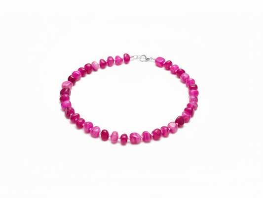 The Circle handcrafted statement necklace featuring vibrant pink polished agate gemstone beads and silver lobster clasp