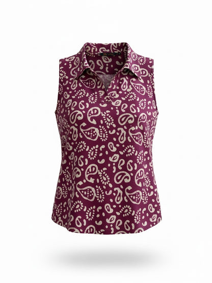 The Circle sleeveless polo top in deep purple with a white paisley batik print and a structured collar.