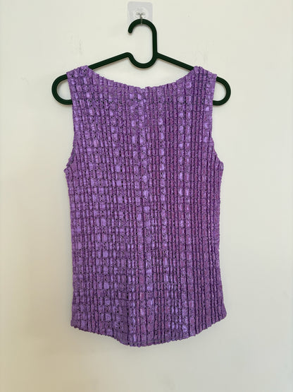 The Circle purple sleeveless top with a textured crinkle fabric finish and a classic V-neckline on a hanger.