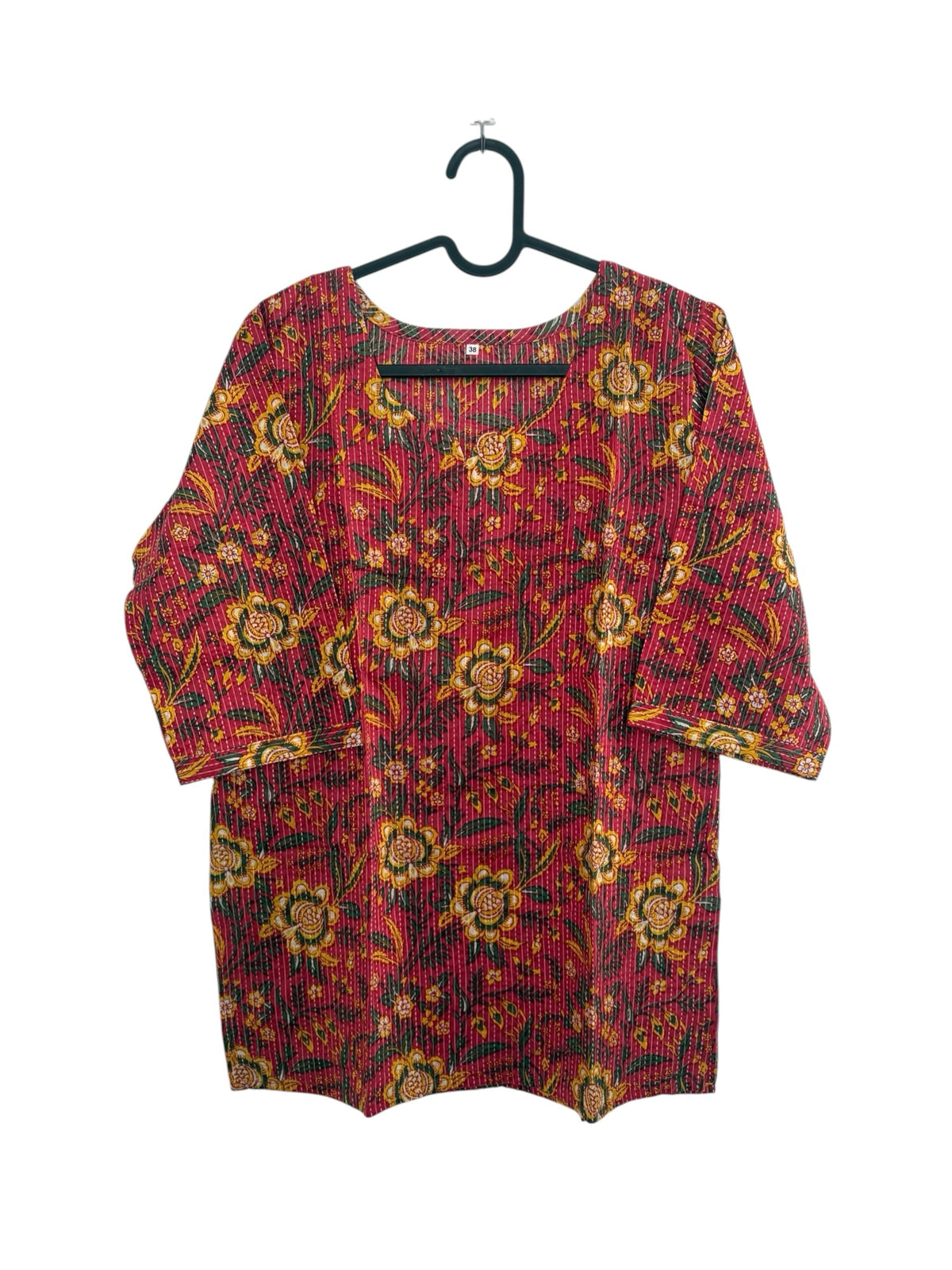 The Circle red cotton kurta with yellow and green floral block prints and delicate kantha-style vertical stitching.