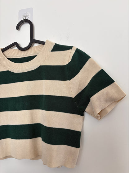 The Circle striped knit crop top in forest green and cream with a ribbed crew neckline and short sleeves.