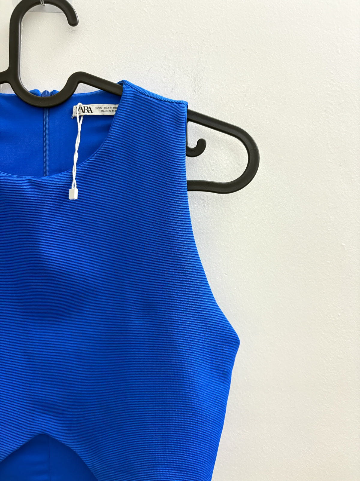 The Circle ZARA royal blue sleeveless cropped top with textured fabric and front cut-out detail on a black hanger